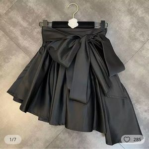 - NWT, Black stain A-symmetrical skirt with detachable sash, Size small.